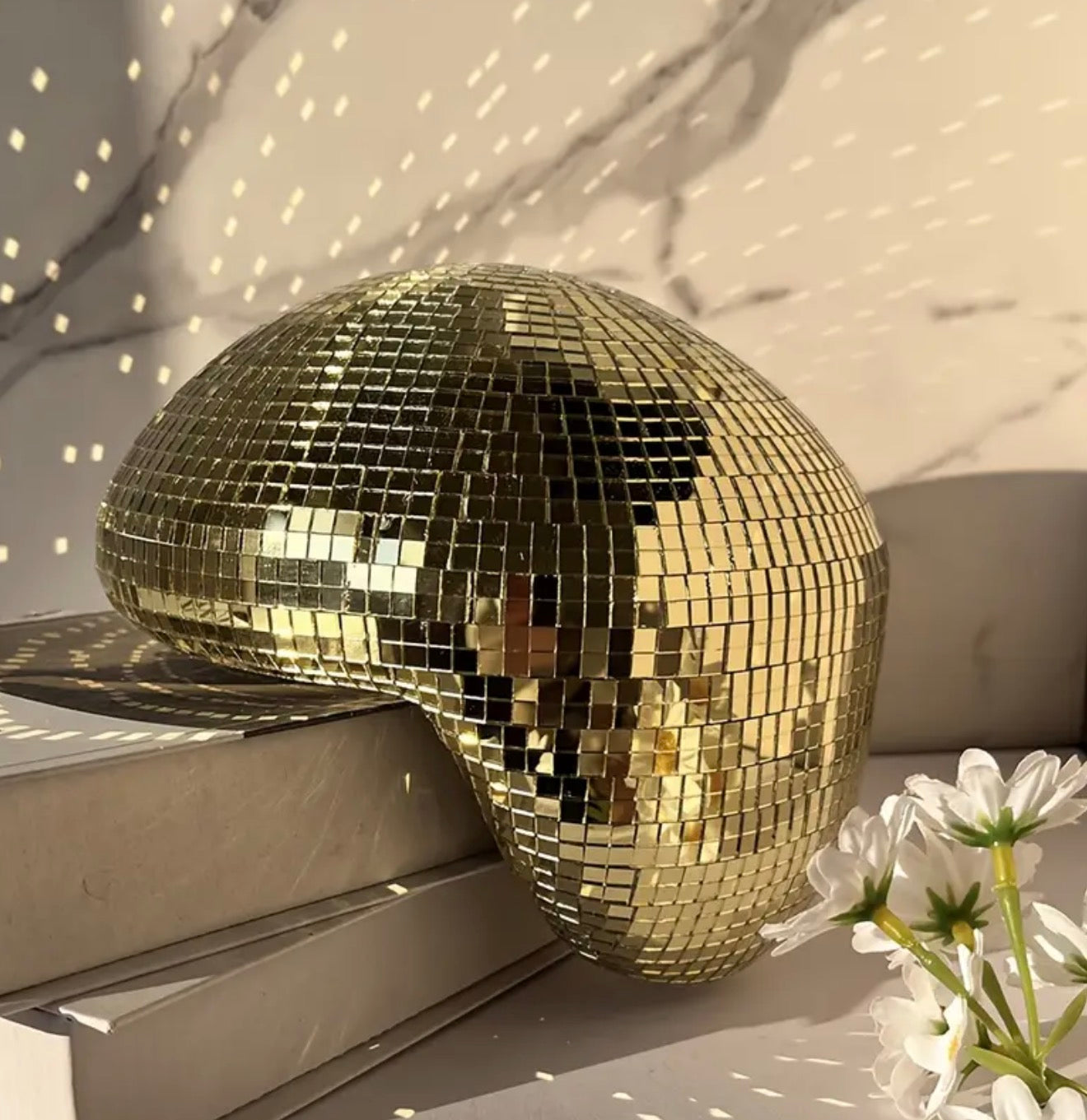 Melting disco ball gold